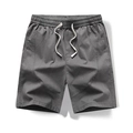 Pantaloncini sportivi da uomo grigio scuro con elastico in vita e tasche laterali - M / Grigio