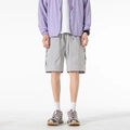 Pantalones cortos tipo cargo para hombre en gris claro con cordón y bolsillos de solapa - M / Gris París