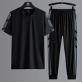 Men's quick-dry black sports suit with gray geometric details on t-shirt and pants - M / Black - T-Shirt And Cuffed Pants Set
