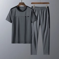 Grijs heren trainingspak voor de zomer met T-shirt met korte mouwen en een lange broek - M / Grijs