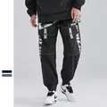 Ανδρικό μαύρο παντελόνι cargo techwear με λευκές ραφές αντίθεσης και πλαϊνές τσέπες - M / Μαύρο