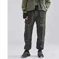 Pantaloni cargo uomo verde scuro con tasche multiple, cinturini e caviglie a costine - M / Verde