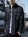 Dettaglio camicia cargo nera a maniche lunghe con tasche sul petto e tessuto resistente - M / Nero