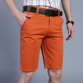 Men's casual orange cotton shorts in straight-fit cut with side pockets and black belt - EU 30 / Orange Red