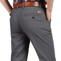 Men's grey business casual trousers in high-quality cotton twill with brown leather belt detail - Gray
