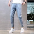 Jeans slim da uomo in lavaggio blu chiaro con leggeri dettagli usurati e stile - EU 27 / Grigio