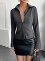 Detail of dark grey striped button-up shirt paired with a chic black leather skirt - S / Gray