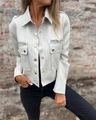 Detail shot of a light gray cropped utility jacket featuring metal buttons and shoulder straps - S / White