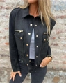 Detail of black faux suede jacket featuring golden metallic zippers and decorative buttons - S / Black