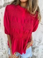 Detail of red smocked texture and buttoned neckline on a casual summer blouse - S / Red