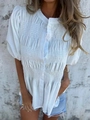 Detailed view of white smocked texture and buttoned front on summer short sleeve blouse - S / White