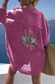 Detail of sequin eye embroidery on the back of a rose pink long-sleeved cotton shirt - S / Rose Red