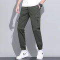 Men's dark green cargo joggers featuring drawstring waist and large side flap pockets - 660 Military Green / 29
