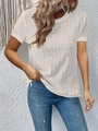 Detailed view of white short-sleeve top featuring intricate hollow lace and wave textures - S / Short Sleeve Top / Apricot