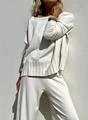 Close-up of premium white knit fabric texture on relaxed sweater and wide-leg pants - S / White
