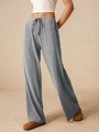 Dettaglio dei pantaloni grigi a gamba larga con coulisse e tessuto a costine per donna - S / Grigio