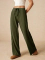 Dettaglio dei pantaloni larghi verde scuro con trama a coste e coulisse regolabile in vita - S / Verde Militare