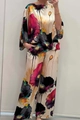 Detail view of artistic floral print and lightweight satin fabric on a two-piece set - S / Top And Bottom / Black