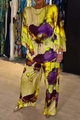 Detailed macro view of elegant satin floral print fabric with artistic purple flowers - Yellow