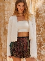 Detailed view of colorful sequins and white fringe texture on the stylish party outfit - XS / Bottoms / Metallic Gold