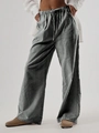 Dettaglio dei pantaloni a gamba larga a righe bianche e nere con coulisse in vita - S / Nero