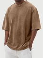 Detail of heavyweight washed cotton fabric and ribbed crewneck on men's vintage brown t-shirt - Dark Brown