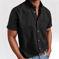 Detalle de camisa negra de manga corta con bolsillo en el pecho y cuello clásico - S / Negro
