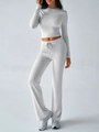 Close-up of light grey ribbed knit fabric on sporty long sleeve top and drawstring pants - S / Top And Bottom / Light Gray