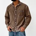 Close-up of vintage brown washed men's shirt showing turn-down collar and chest pocket - Heavy Washed Dark Brown