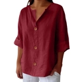 Detailed macro view of the V-neckline with natural wooden buttons on a burgundy linen top - S / Burgundy