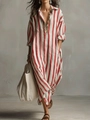 Detail view of red striped oversized maxi dress with collar and practical side pockets - Red