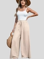 Dettaglio dei pantaloni larghi in cotone e lino a vita alta con coulisse in tinta beige - S / Albicocca