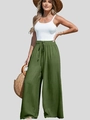 Dettaglio del cordoncino su pantaloni larghi in lino a vita alta con trama naturale verde - S / Verde Militare