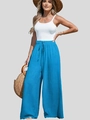 Dettaglio dei pantaloni larghi in lino blu a vita alta con coulisse ed elastico - S / Blu