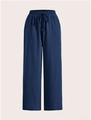 Detail of navy blue wide-leg trousers showing drawstring waist and natural linen texture - S / Navy Blue