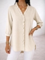 Detail of V-neck ruffle trim and irregular curved hem on beige casual ladies shirt - S / Off White
