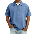 Detail of light blue denim polo shirt featuring a half-zip neckline and raglan sleeves - Blue