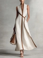 Elegante abito smanicato in cotone lino beige con bordi marroni a contrasto e cintura - Bianco
