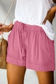 Close-up of rose pink high-waisted shorts with drawstring and large utility pockets - S / Bottoms / Light Pink