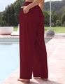 Dettaglio dei pantaloni larghi in lino rosso vino con pratiche tasche laterali - S / Borgogna