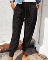 Women's leopard print jogger pants in black and grey with adjustable drawstring waist - S / Black