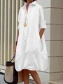 Detail view of a white long sleeve shirt dress with lantern hem and side pockets - S / White