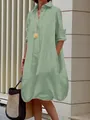 Detail of mint green button-down shirt dress with long sleeves and loose fit silhouette - Light Green