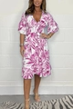Detail of V-neckline and purple tropical leaf print on white smocked waist summer dress - Pink