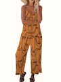 Gelber Sommer-Jumpsuit mit weitem Bein und schwarzem abstrakten Gesichts-Print mit Spaghetti-Trägern - 1XL / Orange