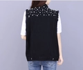 Detail of black denim vest with dense white pearl embellishments and frayed sleeve edges - XS / Black Vest