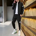 Survêtement homme noir réfléchissant avec doublure polaire et bandes blanches latérales - M / Noir Doublé de Polaire