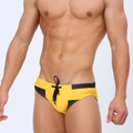 Detail of yellow men's swim briefs with black geometric side panels and waist drawstring - M / Yellow Black