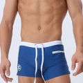 Detailed close-up of men's navy swim shorts showing white drawstring and zipper side pocket - Aqua