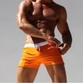 Men's quick-dry orange swimming trunks with white elastic waistband and zipper pocket - Orange